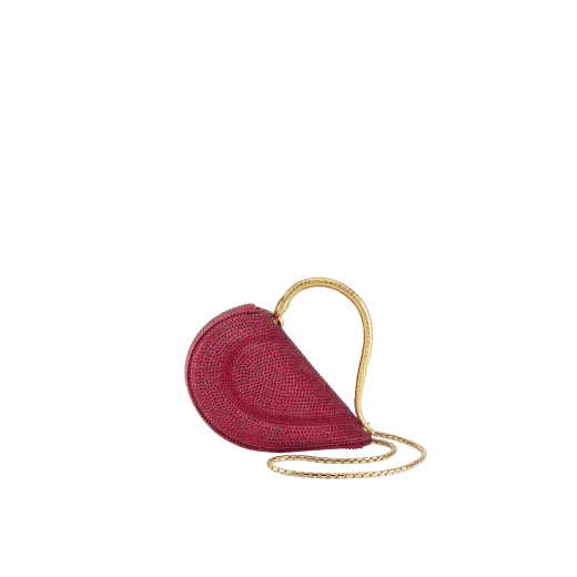Serpenti Cuoricino mini top handle bag with gold Neige Pavé Crystals applied on a suede base and bright Travertino nappa leather lining. Captivating snake body-shaped top handle in gold-plated brass embellished with engraved scales; press-button closure. SRN-001-1366XS-CRYS image 5