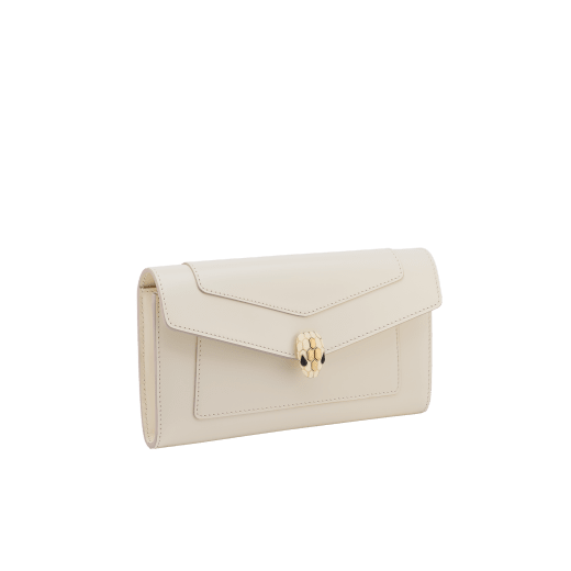 Serpenti Forever large wallet in black calf leather with emerald green nappa leather interior. Captivating snakehead magnetic closure in light gold-plated brass embellished with black enamel and light gold-plated brass scales, and black onyx eyes. SEA-LONG-WLT-R image 1
