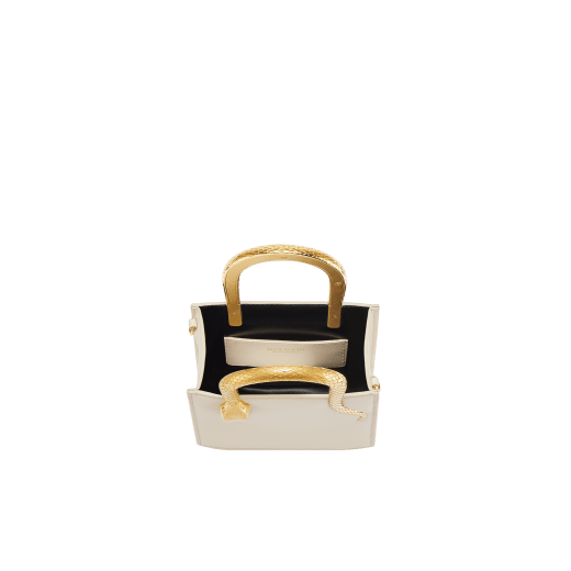 Serpentine mini tote bag in ivory opal Metropolitan calf leather with black nappa leather lining. Captivating snake body-shaped handles in gold-plated brass embellished with engraved scales and red enamel eyes. SRN-1223-CL image 4