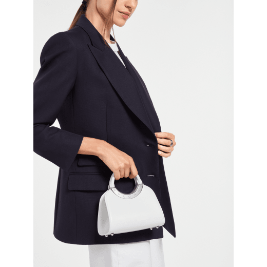 Bvlgari Roma mini top handle bag in flash diamond white Metropolitan calf leather with milky opal nappa leather lining. Iconic metal detail in palladium-plated brass engraved with the Bvlgari logo, and magnetic press-button closure. BVR-001-1310XS-CALF image 1