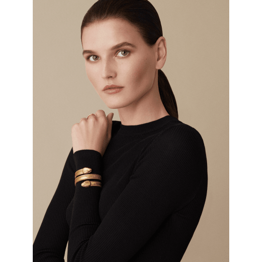 "Serpenti Forever" multi-coil Cleopatra bangle in "Molten" gold karung skin, offering a touch of radiance for the Winter Holidays. New double Serpenti head in gold-plated brass, complete with ruby-red enamel eyes. Cleopatra-MK-G image 2