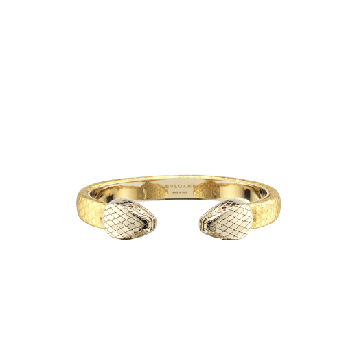 "Serpenti Forever" bangle bracelet in gold "Molten" karung skin. New contraire Serpenti head embellishment in light gold-plated brass, finished with seductive red enamel eyes. SPContr-MoltK-G image 1