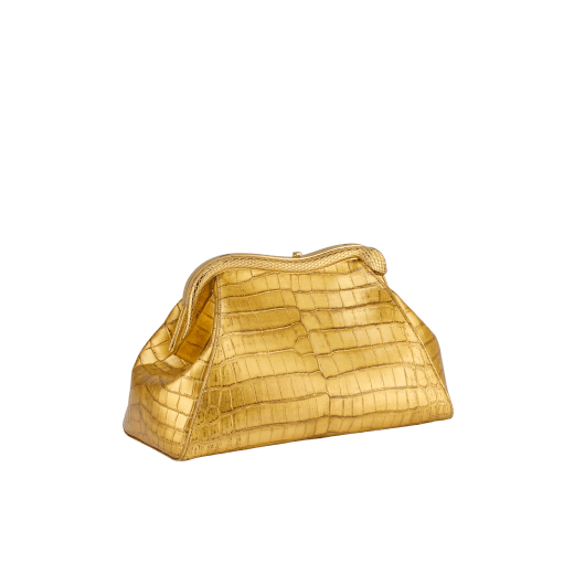 Serpentine medium pouch in antique gold soft metallic crocodile skin with 24 kt gold treatment and emerald green nappa leather lining. Captivating snake-shaped frame in gold-plated brass including 3 µ of 24 kt gold, embellished with engraved scales and red enamel eyes on one side and antique gold soft metallic crocodile insert on the other, and press-button closure. Exclusive Bulgari 50th anniversary in the US Edition. 292590 image 6