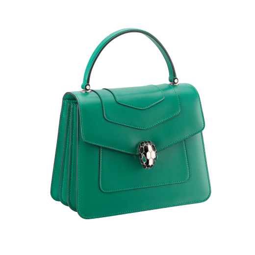 “Serpenti Forever” top handle bag in emerald green calf leather. Iconic snake head closure in light gold-plated brass enhanced with black and white agate enamel and green malachite eyes. 1050-CL image 2