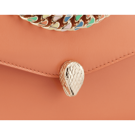 "Serpenti Forever" maxi chain pochette in Blush Quartz pink calf leather and Deep Garnet burgundy nappa leather. New Serpenti head closure in gold-plated brass, finished with red enamel eyes. SEA-XLCHAINPOUCH image 6