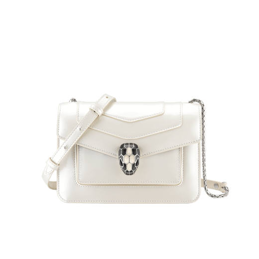 “Serpenti Forever” crossbody bag in white agate calf leather with a varnished and pearled effect. Iconic snakehead closure in light gold plated brass enriched with black and pearled white agate enamel and black onyx eyes. 1082-VCL image 1
