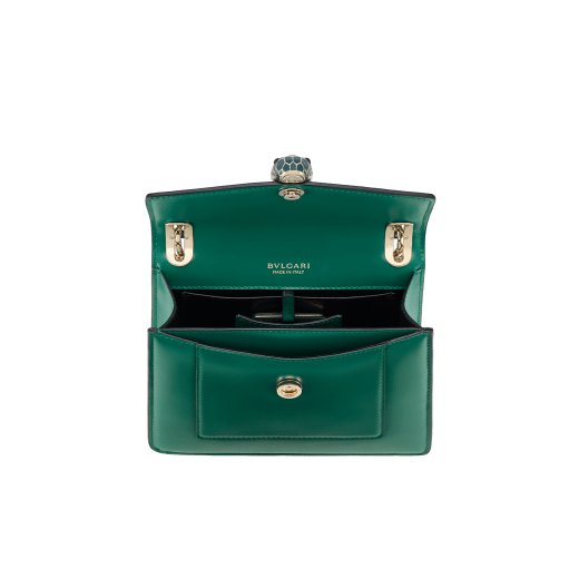 Serpenti Forever Day-to-Night small shoulder bag in emerald green calf leather with black nappa leather lining. Captivating snakehead magnetic closure in light gold-plated brass embellished with deep jade intense green enamel and light gold-plated brass scales, and black onyx eyes. SEA-1281-CL image 4