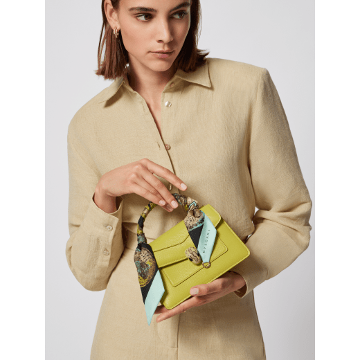 Serpenti Forever mini top handle bag in linden peridot yellowish green Pure karung skin with crystal rose pink nappa leather lining. Captivating snakehead magnetic closure in light gold-plated brass embellished with linden peridot yellowish green enamel and light gold-plated brass scales, and black onyx eyes. SEA-1283-EX image 3