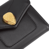 Serpenti Reverse compact wallet in Sahara amber light brown quilted Metropolitan calf leather with taffy quartz pink Metropolitan calf leather interior. Captivating snakehead press button closure in gold-plated brass embellished with red enamel eyes. SRV-COMPACTWLT image 4