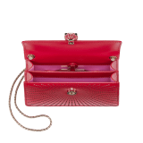 Serpenti Forever mini crossbody bag in amaranth garnet red laser-cut calf leather with taffy quartz pink nappa leather lining. Captivating snakehead closure in light gold-plated brass embellished with matt and shiny amaranth garnet red enamel scales and black onyx eyes. Online Exclusive. 986-LCL image 4