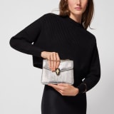Serpenti Forever small crossbody bag in silver Molten lizard skin with foggy opal grey nappa leather lining. Captivating snakehead magnetic closure in light gold-plated brass embellished with black enamel and light gold-plated brass scales, and black onyx eyes. 293341 image 2