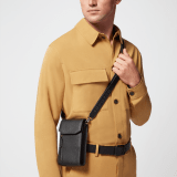 BULGARI Man vertical pochette in black metal-free calf leather with Olympian sapphire blue regenerated nylon (ECONYL®) lining. Dark ruthenium-plated brass hardware, hot-stamped BULGARI logo and magnetic fastening. BMA-VERTICALCASE image 5