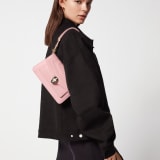 Serpenti Forever East-West small shoulder bag in primrose quartz pink calf leather with heather amethyst pink grosgrain lining. Captivating snakehead magnetic closure in light gold-plated brass embellished with black and white agate enamel scales and black onyx eyes. 1237-Cla image 4