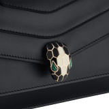 Serpenti Forever East-West small shoulder bag in black calf leather with emerald green gros grain lining. Captivating snakehead magnetic closure in light gold-plated brass embellished with black and white agate enamel scales, and green malachite eyes. 1237-CLa image 3