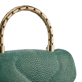 Serpenti Reverse small top handle bag in soft emerald green galuchat skin with amethyst purple nappa leather lining. Captivating magnetic snakehead closure in light gold-plated brass embellished with red enamel eyes. 1234-SG image 7