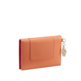 Serpenti Forever Special Resort Edition folded card holder in coral carnelian orange calf leather with beetroot spinel fuchsia nappa leather interior. Captivating snakehead charm embellished with red enamel eyes and a palm charm, both in light gold-plated brass, and press button closure. SEA-CC-HOLDER-FOLD-Clb image 3