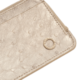 BULGARI BULGARI large zipped card holder in light gold metallic ostrich skin with shell quartz pink nappa leather interior. Zip closure with iconic zip pull in light gold-plated brass. 293549 image 4