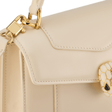 Serpenti Forever medium top handle bag in emerald green calf leather with black nappa leather lining. Captivating snakehead magnetic closure in light gold-plated brass embellished with deep jade intense green enamel and light gold-plated brass scales, and black onyx eyes. SEA-1282-CL image 5