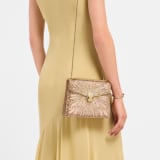 Serpenti Forever Day-to-Night small shoulder bag in multigradient Fireworks Crystals with black nappa leather lining. Captivating snakehead magnetic closure in gold-plated brass embellished with diamond-cut engraving on the scales, and black onyx eyes. SEA-001-1281S-fireworks image 1