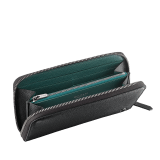 "BVLGARI BVLGARI" men's large zipped wallet in black and Forest Emerald green "Urban" grain calf leather. Iconic logo embellishment in dark ruthenium-plated brass with black enamelling. BBM-WLTZIPASYM image 2