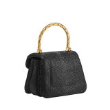 Serpenti Reverse micro top handle bag in soft emerald green galuchat skin with black nappa leather lining. Captivating magnetic snakehead closure in light gold-plated brass embellished with red enamel eyes. SRV-NANOREVERSE image 3