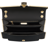 Serpenti Forever medium shoulder bag in black Metropolitan calf leather with light gold-plated brass frames and black nappa leather lining. Captivating snakehead magnetic closure in light gold-plated brass embellished with black enamel scales, and black onyx eyes. 1077-MF image 4
