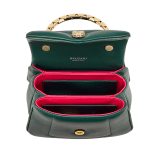 Serpenti Reverse small top handle bag in black quilted Metropolitan calf leather with black nappa leather lining. Captivating snakehead magnetic closure in gold-plated brass embellished with red enamel eyes. 1234-MCL image 4