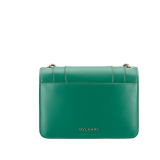 Serpenti Forever small crossbody bag in emerald green calf leather with amethyst purple grosgrain lining. Captivating snakehead closure in light gold-plated brass embellished with black and white agate enamel scales and green malachite eyes. 1082-CLa image 3