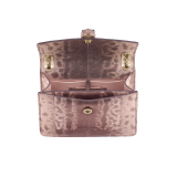 Serpenti Forever Day-to-Night small shoulder bag in Laguna blue shiny karung Cabochon skin with metal studs and black nappa leather lining. Captivating snakehead magnetic closure in light gold-plated brass embellished with bright Laguna blue enamel and light gold-plated brass scales, and black onyx eyes. SEA-1281-P image 4