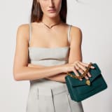 Serpenti Forever Maxi Chain small crossbody bag in flash diamond white grained calf leather with foggy opal grey nappa leather lining. Captivating snakehead magnetic closure in gold-plated brass embellished with white mother-of-pearl scales and red enamel eyes. 1134-MCGC image 3