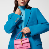 Alexander Wang x Bulgari small belt bag in azalea quartz pink calf leather with black nappa leather lining. Captivating double Serpenti head magnetic closure in antique gold-plated brass embellished with red enamel eyes. 292314 image 6