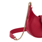 Serpenti Ellipse micro crossbody bag in soft drummed and smooth flamingo quartz pink calf leather with flamingo quartz pink gros grain lining. Captivating snakehead closure in gold-plated brass embellished with red enamel eyes. Online exclusive colour. SEA-MICROHOBOb image 5