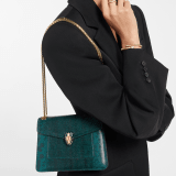 Serpenti Forever Day-to-Night small shoulder bag in light amethyst pure karung with light amethyst nappa leather lining. Captivating snakehead magnetic closure in gold-plated brass embellished with light amethyst enamel and gold-plated brass scales, and black onyx eyes. SEA-001-1281S-KAR image 1