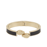 Serpenti Forever bangle in gold-plated brass with black Metropolitan calf leather inserts. Captivating double snakehead hinge closure in gold-plated brass embellished with red enamel eyes. SERP-HINGEBRCLT-MCL-B image 1