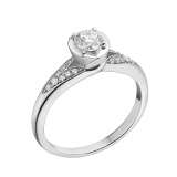 Incontro d’Amore ring in platinum with round brilliant-cut diamond and pavé diamonds. Available from 0.20 ct. As its pavé rows embrace a diamond apex, Incontro d’Amore joins two hearts as one. 352112 image 1