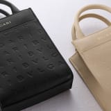 Bulgari Logo mini tote bag in black calf leather with hot-stamped Infinitum pattern and teal topaz green grosgrain lining. Light gold-plated brass hardware. BVL-1228S-ICLa image 6
