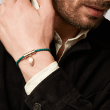 Serpenti Forever bracelet in emerald green braided calf leather. Light gold-plated brass captivating snakehead charm embellished with red enamel eyes, attached on the frontal clasp closure. SERP-HERBRAID-WCL-EG image 3