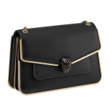Serpenti Forever medium shoulder bag in black Metropolitan calf leather with light gold-plated brass frames and black nappa leather lining. Captivating snakehead magnetic closure in light gold-plated brass embellished with black enamel scales, and black onyx eyes. 1077-MF image 2