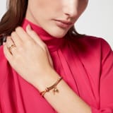 Serpenti Forever Special Resort Edition bracelet in coral carnelian orange fabric. Light gold-plated brass tubular element, captivating snakehead charm embellished with red enamel eyes and palm charm. SERP-PALM-STRING image 2