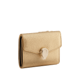"Serpenti Forever" slim compact wallet in soft emerald green calf leather and black nappa leather. Iconic light gold-plated brass snakehead stud closure, finished with black and white agate enamel, and green malachite eyes. SEA-SLIMCOMPACT-Cla image 1