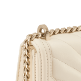 Serpenti Diamond Blast small shoulder bag in ivory opal Sunshine quilted nappa leather with black nappa leather lining. Captivating snakehead closure in light gold-plated brass embellished with matt and shiny ivory opal enamel scales and black onyx eyes. 922-SQ image 6