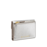 Serpenti Forever slim compact wallet in emerald green calf leather with black nappa leather interior. Captivating snakehead press button closure in light gold-plated brass embellished with black and white agate enamel scales and black onyx eyes. SEA-SLIMCOMPACT-Clb image 3