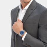 Octo Roma WorldTimer watch with interchangeable satin-polished stainless steel bracelet and additional blue rubber strap, satin-polished stainless steel case and matte blue Clous de Paris dial. Mechanical manufacture movement with automatic winding, WorldTimer, 24 time zones and 24-hour indicator. Water-resistant up to 100 metres. 103762 image 1