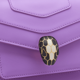 Serpenti Forever small crossbody bag in white agate calf leather with heather amethyst fuchsia grosgrain lining. Captivating snakehead closure in light gold-plated brass embellished with black and white agate enamel scales and green malachite eyes. 1082-CLb image 5