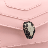 Serpenti Forever small crossbody bag in white agate calf leather with heather amethyst fuchsia grosgrain lining. Captivating snakehead closure in light gold-plated brass embellished with black and white agate enamel scales and green malachite eyes. 1082-CLb image 5