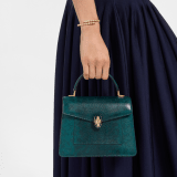 Serpenti Forever medium top handle bag in forest emerald shiny karung with black nappa leather lining. Captivating snakehead magnetic closure in gold-plated brass embellished with forest emerald enamel and gold-plated brass scales, and black onyx eyes. 295626 image 1