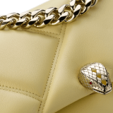 "Serpenti Cabochon" maxi chain crossbody mini bag in soft quilted Ivory Opal white calf leather, with a maxi graphic motif, and black nappa leather internal lining. New Serpenti head closure in gold-plated brass, finished with small white mother-of-pearl scales in the middle, and red enamel eyes. 1164-MSMa image 4