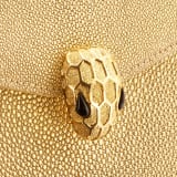 Serpenti Forever top handle bag in gold galuchat skin with black nappa leather lining. Captivating snakehead closure in gold-plated brass embellished with satin-gold scales and black onyx eyes. 752-FG image 5