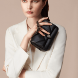 "Serpenti Cabochon" maxi chain crossbody bag in soft quilted black calf leather , with a maxi graphic motif, and black nappa leather internal lining. New Serpenti head closure in dark ruthenium-plated brass finished with small black onyx scales in the middle and red enamel eyes. 1164-NSM image 6