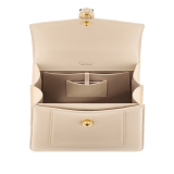 Serpenti Forever medium top handle bag in emerald green calf leather with black nappa leather lining. Captivating snakehead magnetic closure in light gold-plated brass embellished with deep jade intense green enamel and light gold-plated brass scales, and black onyx eyes. SEA-1282-CL image 4